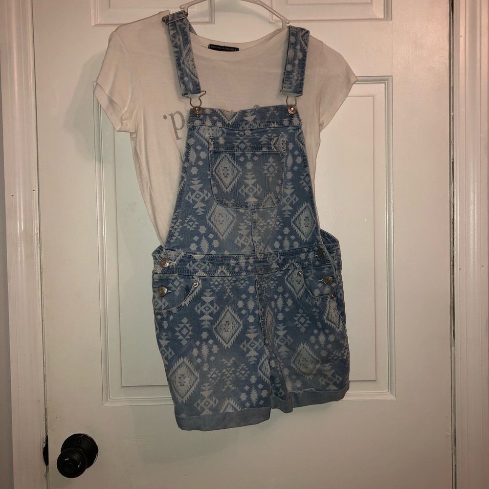 Blue jean overalls with a white triangle design